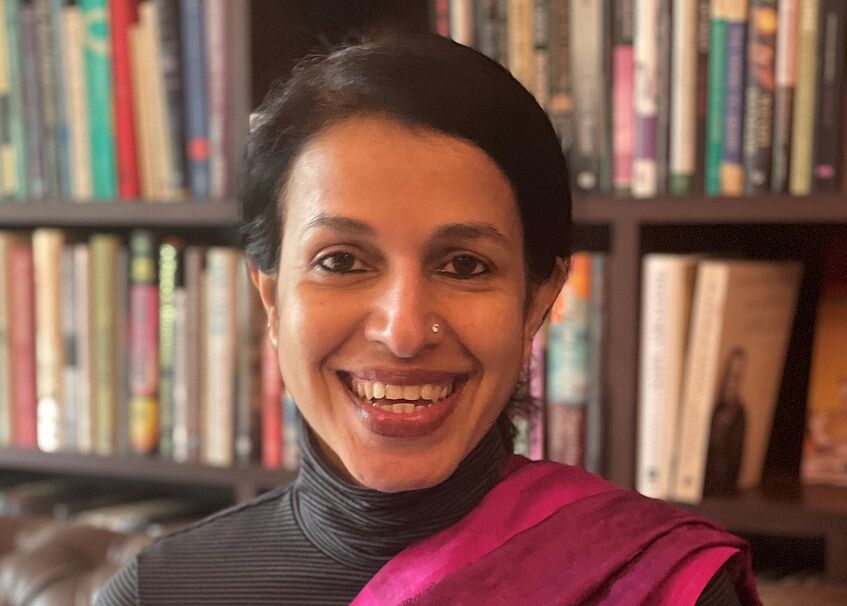 Photo of Madhavi Menon, smiling